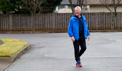 Michael G in a blue coat in the street